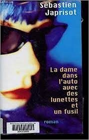 La dame dans l'auto avec des lunettes et un fusil - Click to enlarge picture.